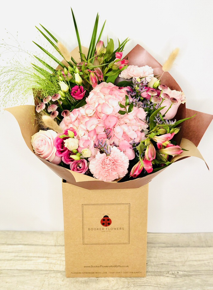 <h2>Pink Handtied Bouquet of Flowers - Hand Delivered</h2>
<p>These beautiful pink flowers hand-arranged by our professional florists into a handtied bouquet are a delightful choice from our new collection. This bouquet contains lots of classic favourites and it would make the perfect gift for any occasion or to let someone know you are thinking of them.</p>
<h2>Flower Delivery Coverage</h2>
<p>Our shop delivers flowers to the following Liverpool postcodes L1 L2 L3 L4 L5 L6 L7 L8 L11 L12 L13 L14 L15 L16 L17 L18 L19 L24 L25 L26 L27 L36 L70 If your order is for an area outside of these we can organise delivery for you through our network of florists. We will ask them to make as close as possible to the image but because of the difference in stock and sundry items, it may not be exact.</p>
<h2>Handtied Bouquet | Flowers in Box with Water</h2>
<p></p>
<p>Handtied bouquets are lovely display of fresh flowers that have the wow factor. The advantage of having a bouquet made this way is that they are artfully arranged by our florists and tied so that they stay in the display.</p>
<br>
<p>They are then gift wrapped and aqua packed in a water bubble so that at no point are the flowers out of water. This means they look their very best on the day they arrive and continue to delight for days after.</p>
<br>
<p>Being delivered in a transporter box and in water means the recipient does not need to put the flowers in a vase straight away, they can just put them down and enjoy.</p>
<br>
<p>Featuring 1 Pink Hydrangea, 2 Pink Roses, 2 Pink Carnations, 2 Pink Alstro, 2 Pink/Purple Santini, 1 Limo, 1 Pink Lissi, 3 Bunny Tails, and 2 Green Fountain Grass together with mixed seasonal foliage.</p>
<h2>Eco-Friendly Liverpool Florists</h2>
<p>As florists we feel very close earth and want to protect it. Plastic waste is a huge problem in the florist industry so we made the decision to make our packaging eco-friendly.</p>
<p>To achieve this, we worked with our packaging supplier to remove the lamination off our boxes and wrap the tops in an Eco Flowerwrap, which means it easily compostable or can be fully recycled.</p>
<p>Once you've finished enjoying your flowers from us, they will go back into growing more flowers! Only a small amount of plastic is used as a water bubble and this is biodegradable.</p>
<p>Even the sachet of flower food included with your bouquet is compostable.</p>
<p>All our bouquets have small wooden ladybird hidden amongst them, so do not forget to spot the ladybird and post a picture on our social media pages to enter our rolling competition.</p>
<h2>Flowers Guaranteed for 7 Days</h2>
<p>Our 7-day freshness guarantee should give you confidence that we will only send out good quality flowers.</p>
<p>Leave it in our hands we will create a marvellous bouquet which will not only look good on arrival but will continue to delight as the flowers bloom.</p>
<h2>Liverpool Flower Delivery</h2>
<p>We are open 7 days a week and offer advanced booking flower delivery, same-day flower delivery, 3-hour flower delivery. Guaranteed AM PM or Evening Flower Delivery and also offer Sunday Flower Delivery.</p>
<p>Our florists deliver in Liverpool and can provide flowers for you in Liverpool, Merseyside. And through our network of florists can organise flower deliveries for you nationwide.</p>
<h2>The Best Florist in Liverpool, your local Liverpool Flower Shop</h2>
<p>Come to Booker Flowers and Gifts Liverpool for your beautiful flowers and plants. For that bit of extra luxury, we also offer a lovely range of finishing touches, such as wines, champagne, locally crafted Gin and Rum, vases, Scented Candles and Chocolates that can be delivered with your flowers.</p>
<p>To see the full range, see our extras section.</p>
<p>You can trust Booker Flowers and Gifts of delivery the very best for you.</p>
<p><em>5 Star review on Yell.com</em></p>
<p><em>Thank you Gemma for your fabulous service. The flowers are of the highest quality and delivered with a warm smile. My sister was delighted. Ordering was simple and the communications were top-notch. I will definitely use your services again.</em></p>
